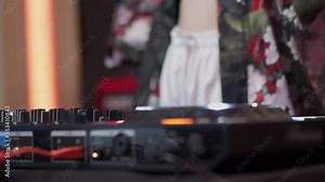 SLOW MOTION female dj jockey disc on music mixing turntable, edm music industrial, live performance, 1080p, disc jockey close up, asian cross culture, asian female standing dj working at night club.