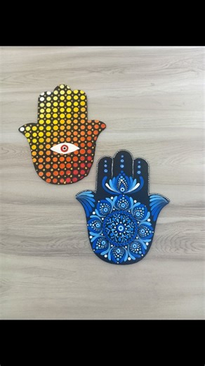 Sukanyaa P on Instagram: "Hamsa Hand with Evil Eye 🖐️🪬 An ancient symbol of protection originating from Middle Eastern & North African cultures, also deeply rooted in Islamic and Jewish traditions. Believed to ward off negative energy and bring blessings, strength & good fortune. Two Hamsa hands, two energies – one art form. 🖐️✨ Hand-painted in dot mandala — each piece carrying intention, colour and calm ✨ 📲 WhatsApp for orders: 6290665944 Inspired from the awesome work of @colour_prism #ham