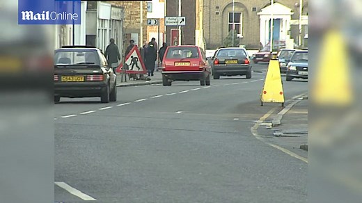 Classic Ford cars in traffic in London in the late 1980s