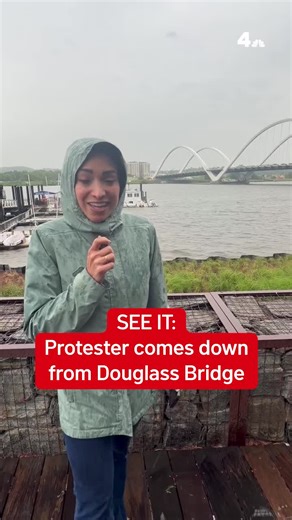 The protester who scaled D.C.'s Frederick Douglass Bridge on Friday afternoon and pitched a tent was off the bridge on Wednesday and now faces charges. The man, Guido Reichstadter, could be seen just after 9 a.m. using a ladder inside the bridge arch to get to a boom lift near the bridge, which he used to get back to the ground. All southbound and northbound traffic on the bridge was stopped for roughly 30 minutes while he climbed down. #washingtondc #dmv #frederickdouglassmemorialbridge #protes