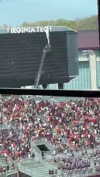 JUST IN: Parachuter slams into the scoreboard at Lane Stadium in Blacksburg, Virginia. The incident took place before the kickoff for Virginia Tech’s 2026 Spring Football Game. According to Virginia Tech spokesperson Mark Owczarsk, the parachuter was rescued within 15 minutes.“We are grateful to report that the skydiver was safely secured and is currently stable. Our primary focus remains on their well-being,” Hokie Sports said.“We extend our sincere appreciation to the first responders, event s
