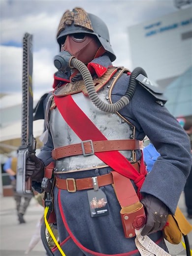 Death Korps of Krieg cosplay from Warhammer 40K universe, filmed at MCM Comic Con London 2025 by Comic Con News Death Korps of Krieg are an elite Astra Militarum regiment from Warhammer 40K, famous for gas masks, trench warfare, total discipline, and unbreakable loyalty to the Imperium of Man. Guardsmen form the ranks, led by Officers and Death Korps Marshals, under the wider command of the Astra Militarum. Cosplayers : @dan_b1066 and @the_chaplain_1bb and @babakaijucosplay video : @Murat Can Ku