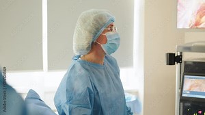 Process of Gynecological surgery operation. Female doctors performing gynecological operation at the hospital healthcare medicine gynecology treatment curing help assistance experience. Real scene.