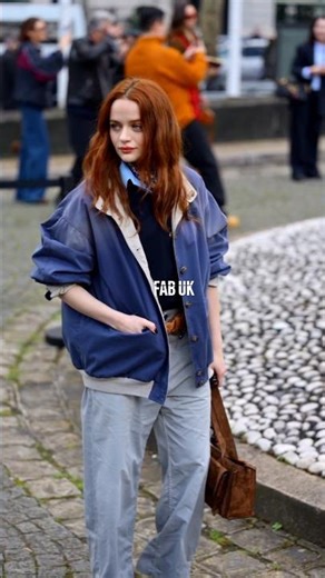 Joey King during the Miu Miu show in Paris, capturing attention with her bold red hair.