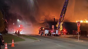 Crews work to extinguish massive warehouse fire in north central Edmonton