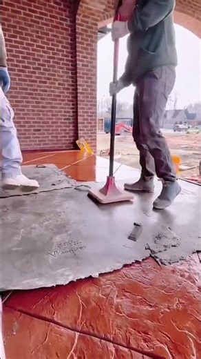 The final process of mixing red cement and quickly and thoroughly working the floor #construction