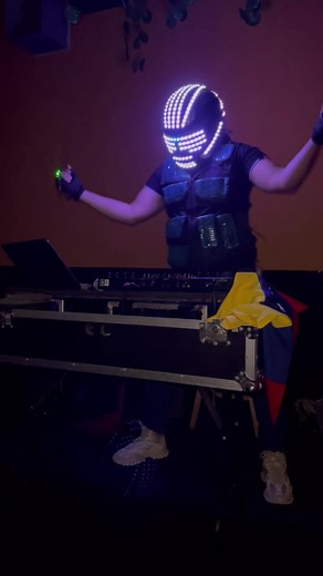 Futuristic DJ Performance with LED Mask and Neon Gloves