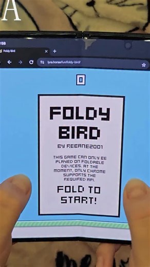 A developer built a Flappy Bird clone where the only way to play is by physically folding your phone and people are destroying their eighteen hundred dollar devices for high scores Meet Rebane who posted Foldy Bird on January second twenty twenty six Its a browser based game that runs only in Chrome on foldable Android phones Instead of tapping the screen you fold and unfold your device The jump happens at the very end of the unfold motion so you violently snap your phone open every time the bir