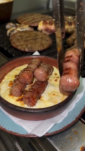 TasteAtlas on Instagram: "Ćevapi u kajmaku at @balkangrill.asanovic 📍Balkans Ćevapi u kajmaku is a traditional Balkan dish featuring grilled minced meat sausages (ćevapi) served with a rich, creamy dairy product known as kajmak. The kajmak adds a smooth, slightly tangy flavor, complementing the smoky, savory taste of the ćevapi. Often accompanied by flatbread and onions, this dish is a hearty and flavorful staple in the region's cuisine."