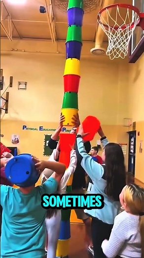 This cup stacking trick requires perfect balance and teamwork