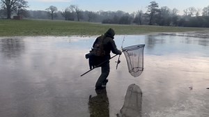 Slippery surprise as fisherman takes an unexpected fall on ice during a freezing fishing trip