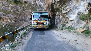 Bus Squeezes Between Cliff & Edge of Road