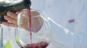 Beautiful people having romantic lunch. Close up wine glasses. Couple toasting during a romantic date