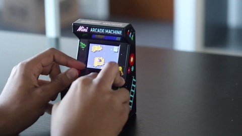 Mini Arcade Machine, 240 Built-in 8-Bit Games, 2.5” Full Colour Screen, 8-Way Joystick, Handheld Retro Games Console – Orb Gaming by ThumbsUp!