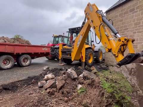 JCB 4CX Backhoe digging Teds Backyard out