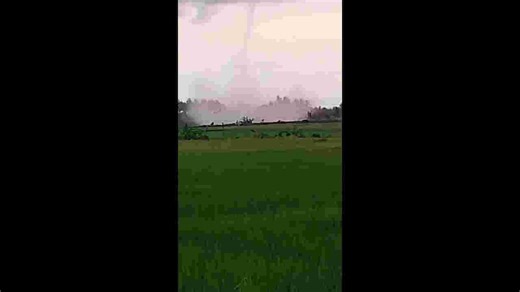 Huge waterspout tornado looms over coastal homes in Indonesia