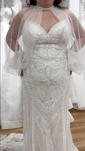 This wedding dress with a bolero jacket gives you versatility from ceremony to reception.