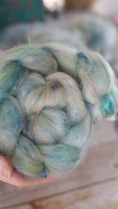 Ever seen those pretty braids of fiber and wonder how they are done? They are actually giant crochet chains made by continually looping the roving through itself. This secures the fiber in a pretty manner, and when you are ready to spin simply find the end and pull it all out.💗 | Cedar Hill Fiber Farm