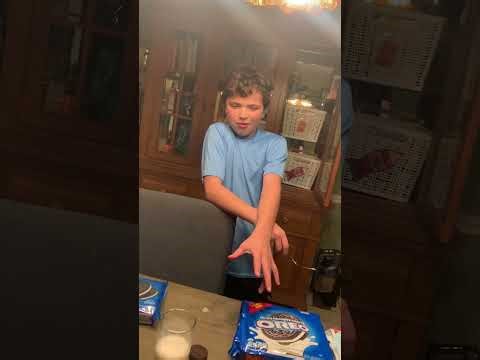 Four different types of Oreos with milk