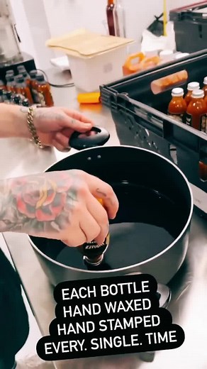 Every bottle hand waxed & hand stamped #fyp #waxing #hotsauce