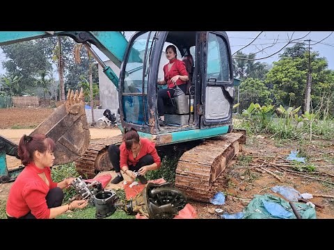 The genius girl repairs and maintains the excavator.