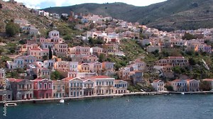 Symi Greece Rhodes is a Greek island It is mountainous and includes the harbor town of Symi and its adjacent upper town Ano Symi, with beautiful neoclassical uniform and colorful houses