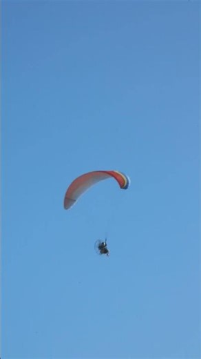 A person engaging in powered paragliding at Packery Channel Jetty pt 2