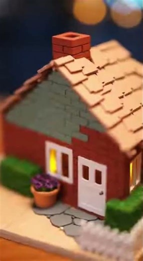 A cinematic 10 second time lapse showing a miniature house built from start to finish Starts with a