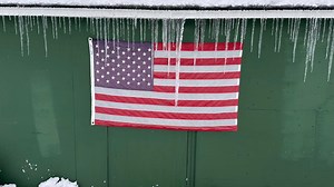 Heavy snow and numbing temperatures keep parts of the US in a deep freeze