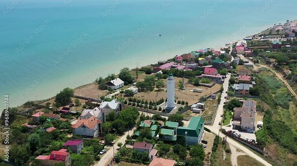 Odessa region, Ukraine. Aerial view of touristic city tovering over black Sea, lighthouse, roof of houses buildings, bluff and people on beach with white sand. Landscape panorama of Europe from above Stock Video