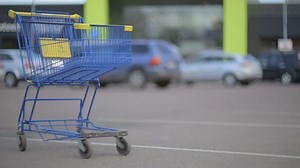 Shopping cart on parking. Shot of a shopping cart on parking near super market. Shot is taken on canon dslr with helious 85mm lens.