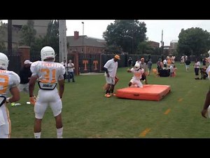 UT running backs execute blocking drills during practice