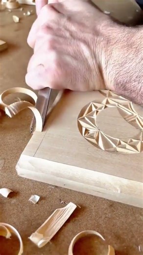 carving a precise groove in a wooden board using a sharp hand tool for detailed joinery work art