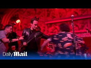 Shocking moment band's comeback gig descends into an on-stage fight