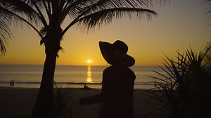 Download Traveler woman asia travel trip summer holiday relaxing tropical beach umbrellas background. for free