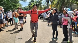 More than a dozen friends and family members of Reed Topasna came together at the trail head of his favorite hiking spot, sharing stories, comforting one another, and remembering a man who did so much to promote the beauty of Guam. | KUAM News