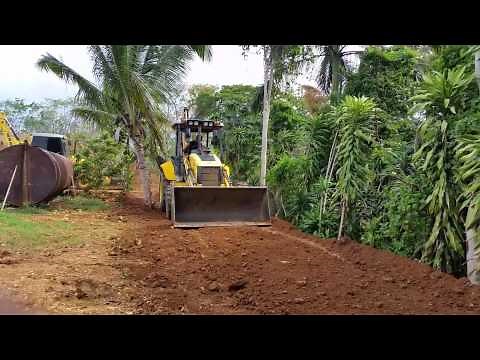 Backhoe clearing and grading