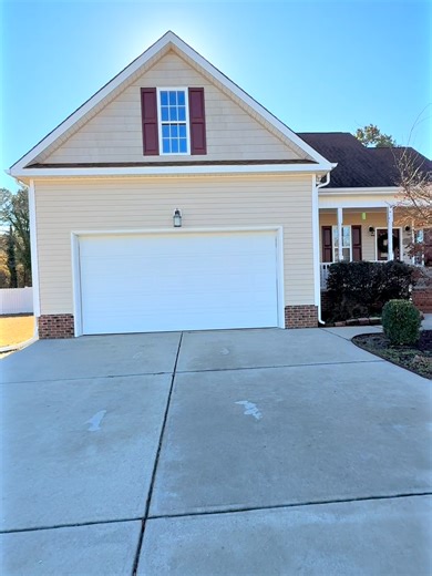 🎥 Take a video tour of 541 Spruce Meadows Lane Willow Springs! Set on a quiet street in the Spruce Meadows community of Willow Spring, this well-maintained ranch-style home offers comfort, space, and thoughtful upgrades throughout. The open living and dining areas feature real hardwood floors that flow seamlessly through the living room, dining room, kitchen, and hallways, complemented by newer interior paint and abundant natural light. The dining room is highlighted by a double tray ceiling an