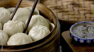 4K Video of Dipping Dim Sum in Soy Sauce