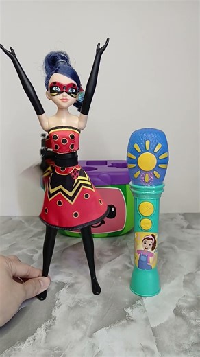 cool microphone and transforming Miraculous doll