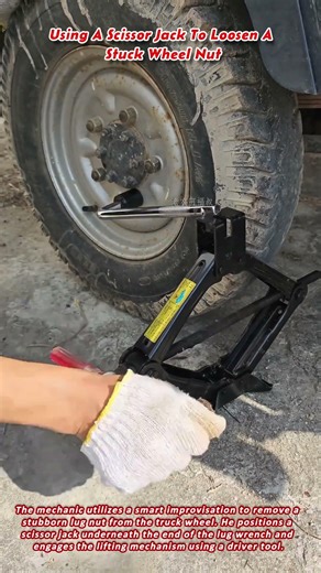 Using A Scissor Jack To Loosen A Stuck Wheel Nut