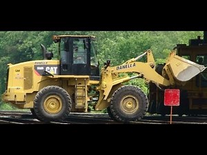Cat Loader on Train Tracks, With Train and Other MOW Equipment