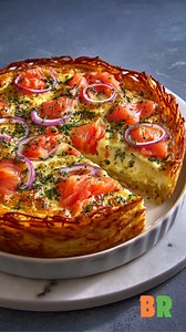 Hash Brown Crust Quiche with Smoked Salmon 🥔🐟✨ A refined, brunch-worthy quiche where crisp hash browns form a golden crust that cradles a silky, smoked-salmon custard. Each slice balances richness with herbaceous brightness and delicate ocean depth. Ingredients: 6 tablespoons unsalted butter, melted and divided 8 cups frozen shredded hash browns, thawed and squeezed dry 3/4 cup Parmigiano Reggiano cheese, divided 2 teaspoons kosher salt, divided 1 teaspoon garlic powder 3/4 teaspoon black pepp
