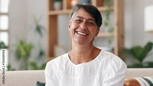 Senior woman, face and laughing for humor in retirement, living room and comedy or comfortable on weekend. Elderly female person, smile and funny joke in portrait, relaxing and happy in nursing home