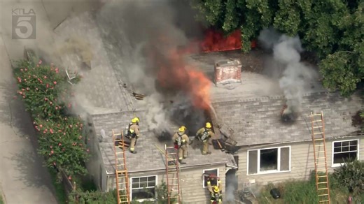 Crews battle raging house fire in East Los Angeles