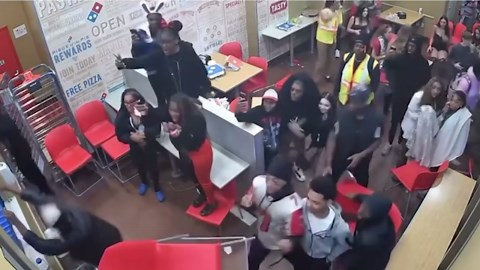 Brawl breaks out inside a Domino's, suspects hurl chair and strike officer's head
