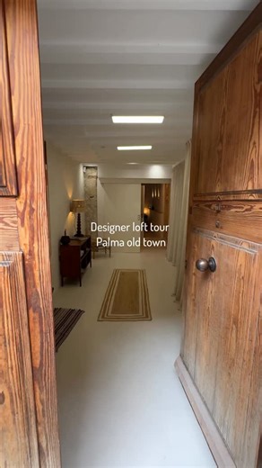 Dr. Helen Cummins on Instagram: "Urban Designer Loft Tour with Patio in Palma’s Old Town 🌿 Step into a piece of 📍Palma’s history with this beautifully reimagined designer loft. Housed in a 13th-century building, it blends timeless character with contemporary refinement. The voluminous living area is defined by high ceilings, soft natural light, and original stone arches, creating a soulful space that feels both artistic and functional. A rustic-style kitchen with Marés sandstone details flows