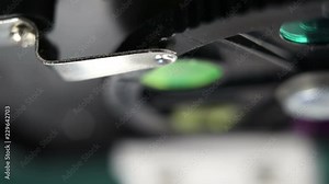 Adjusting microscope filters wheel.