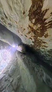 Cave diving through restrictions to see the Dark Room