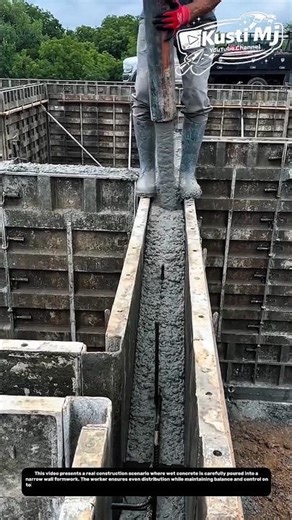 Concrete Wall Casting Process Inside Formwork Using Manual Pouring Technique.